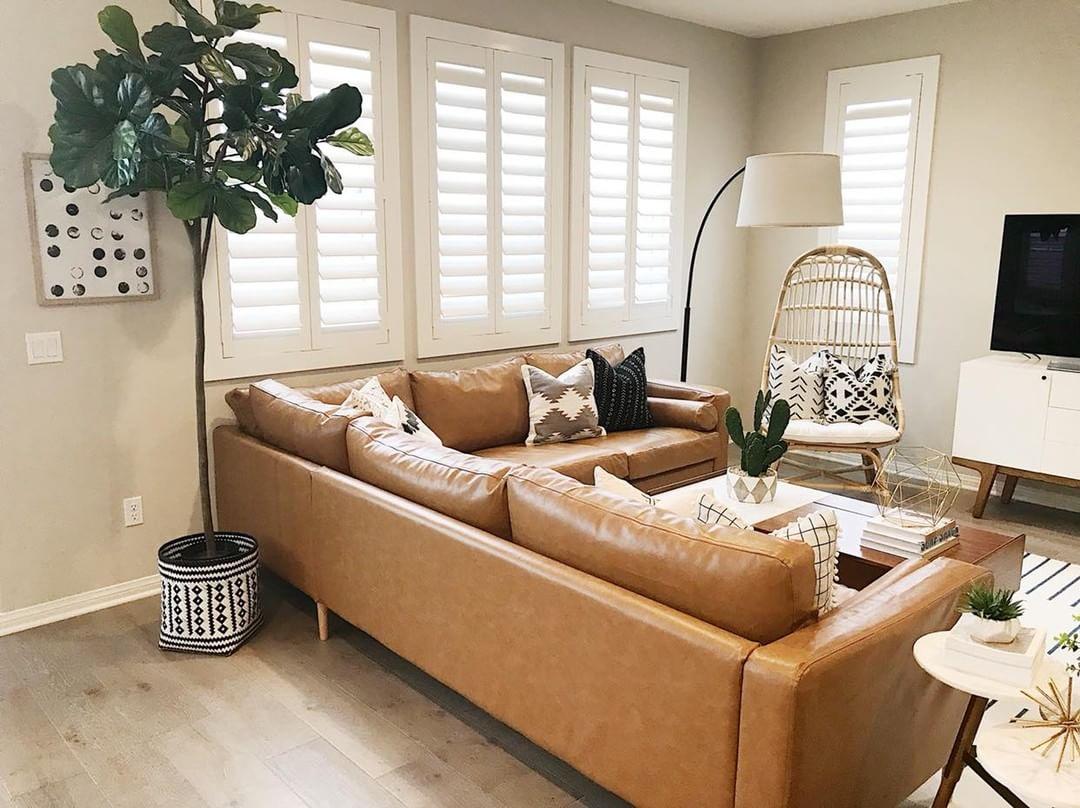 Comfortable living room with our Polywood shutters in Cleveland.